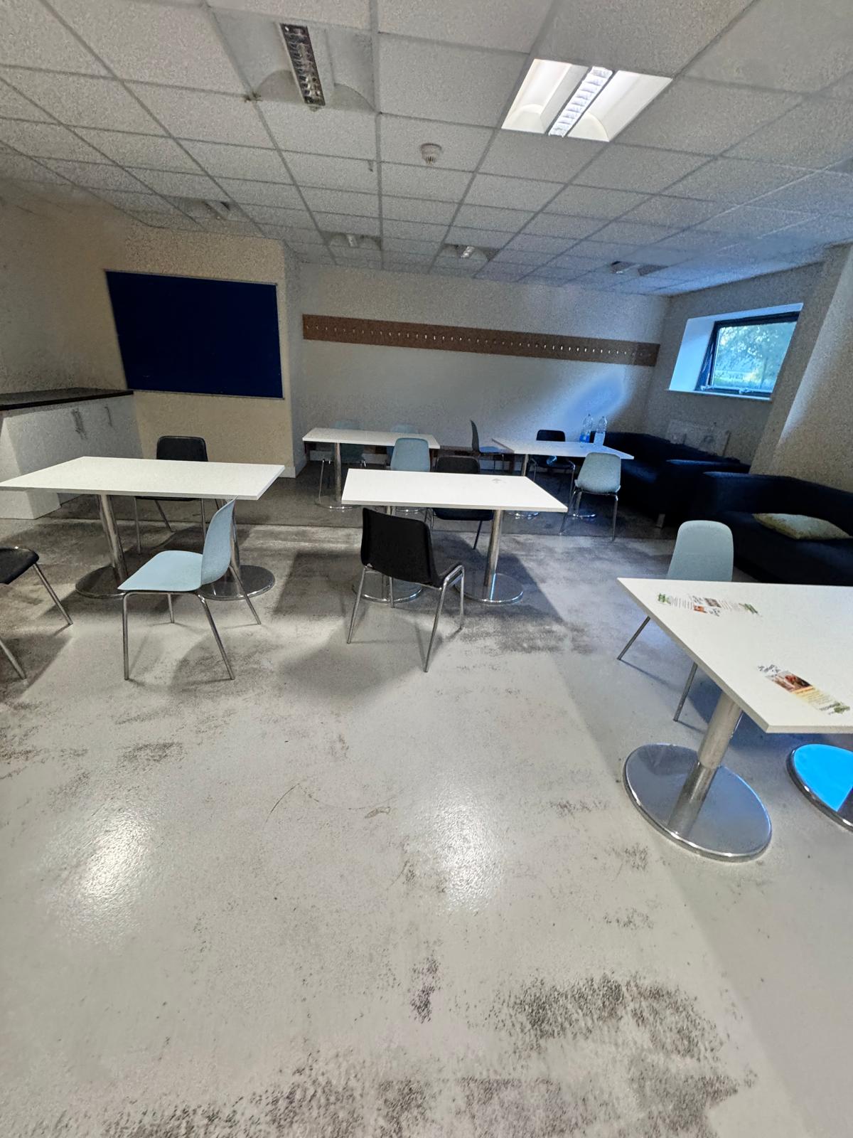 Before — dust and tracked-in dirt across the canteen floor